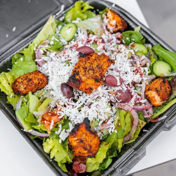 Wahib's Mediterranean Express salad with grilled chicken, feta, olives, red onion, and cucumber.